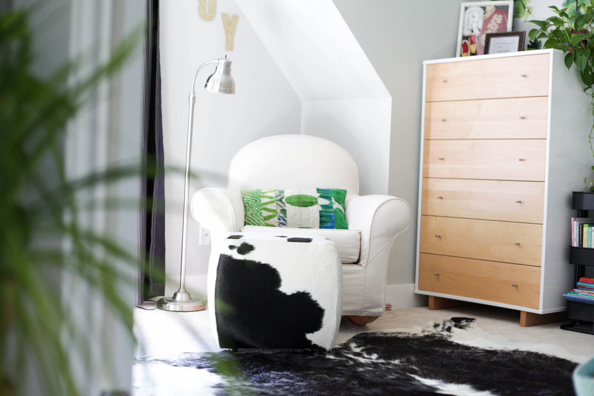 nursery ideas for boys - modern kids room with cowhide rug and ottoman