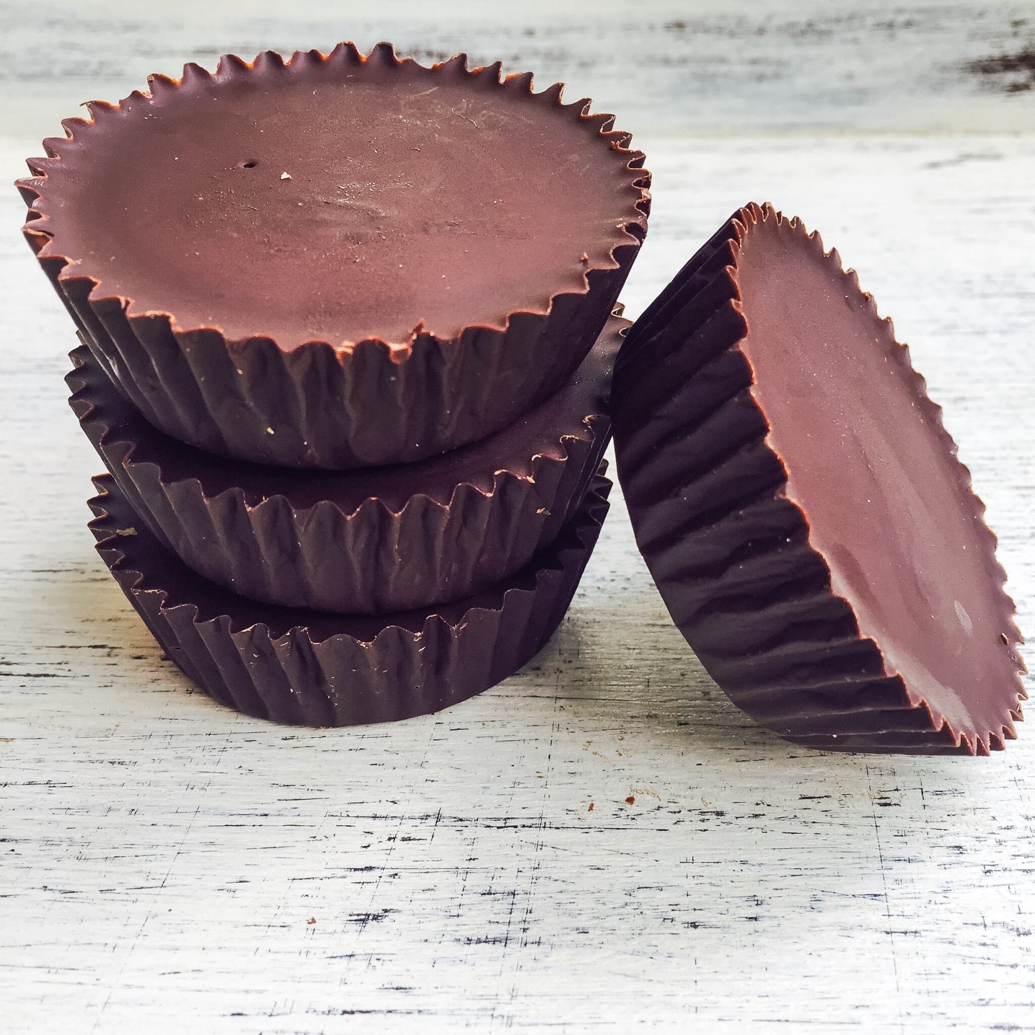 a stack of dark chocolate peanut butter cups from lex daddio from restoring radiance