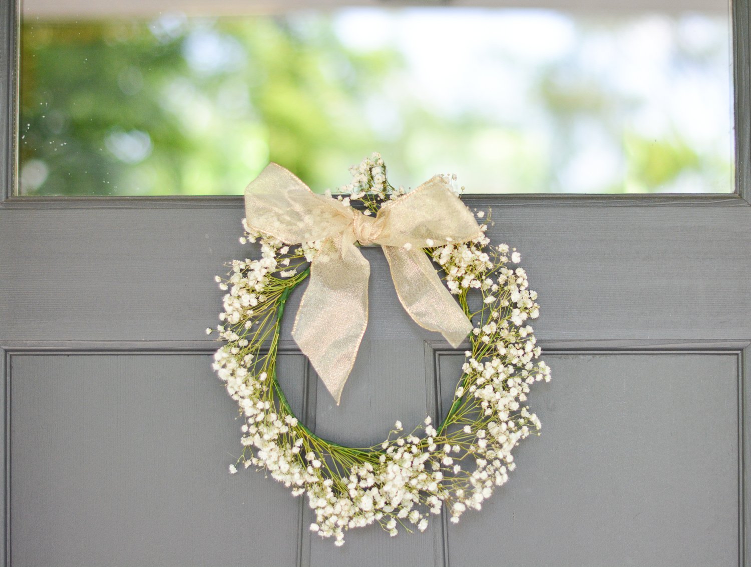 baby's breath wreath with gold bow