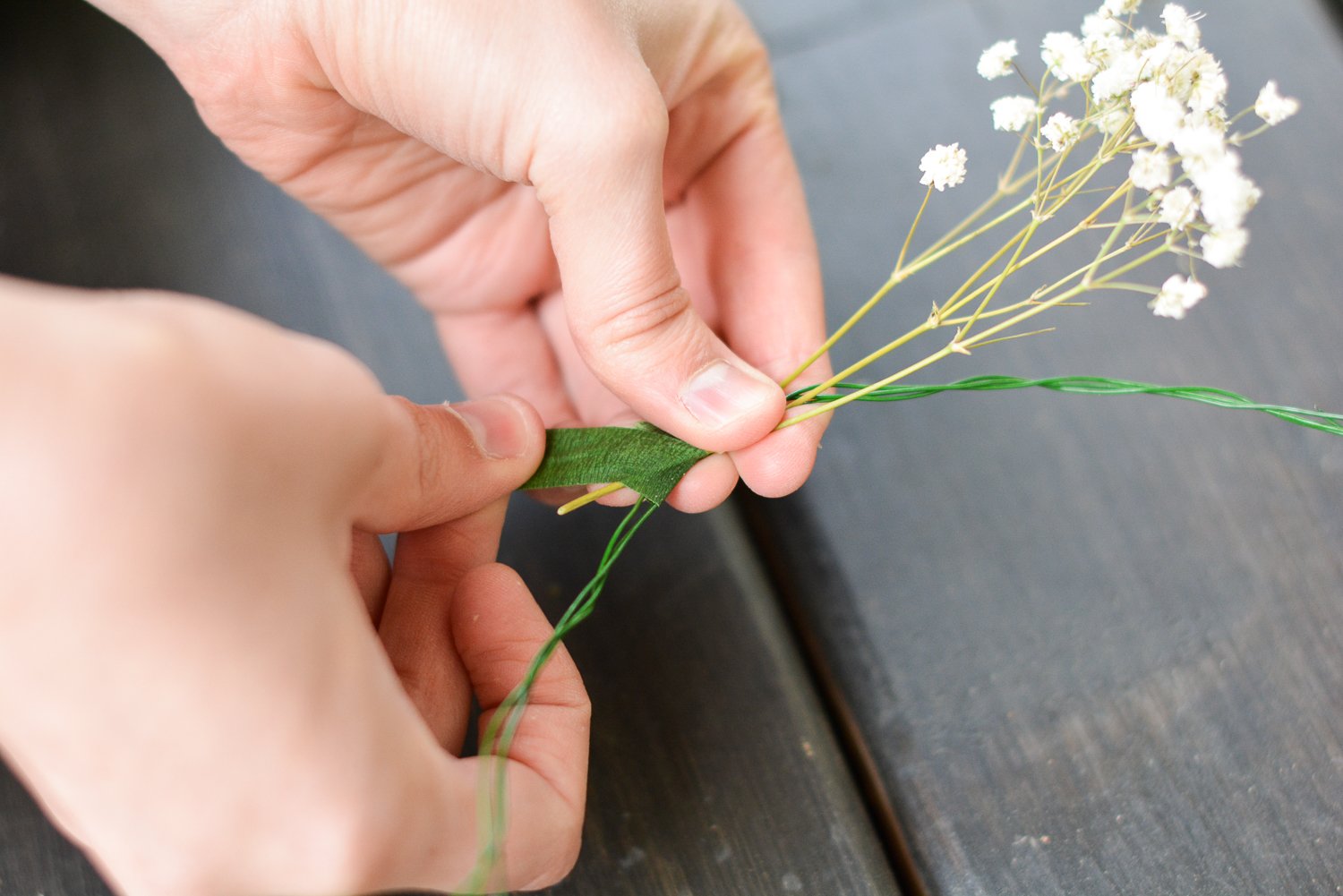 wrapping flowers with green flower tape