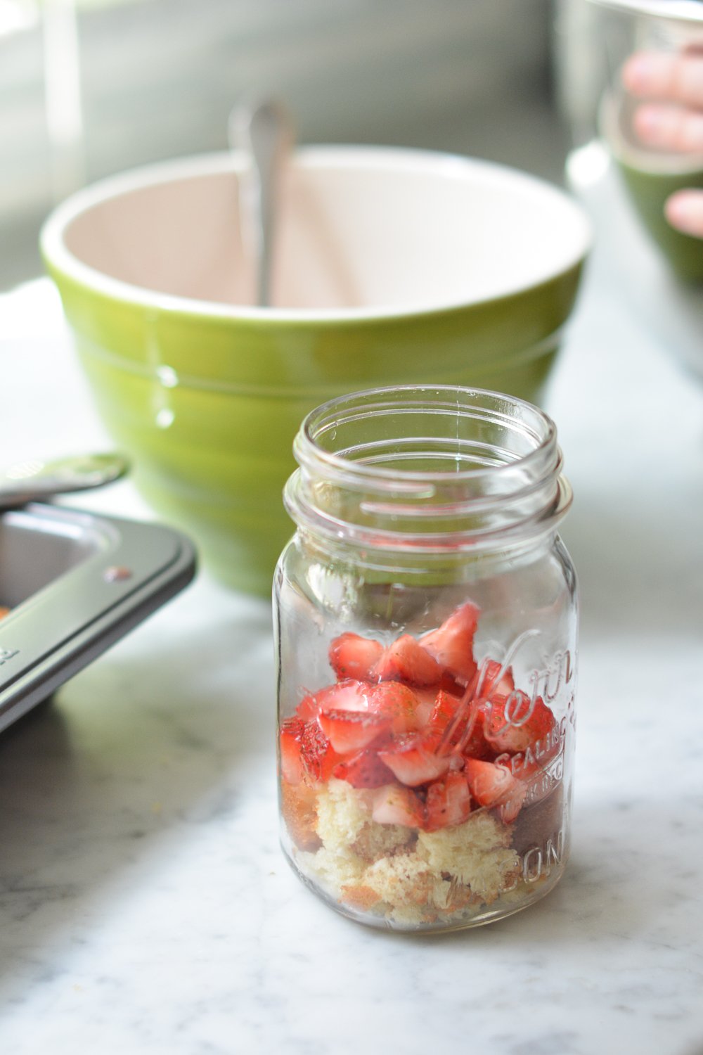 layering the strawberries and cake