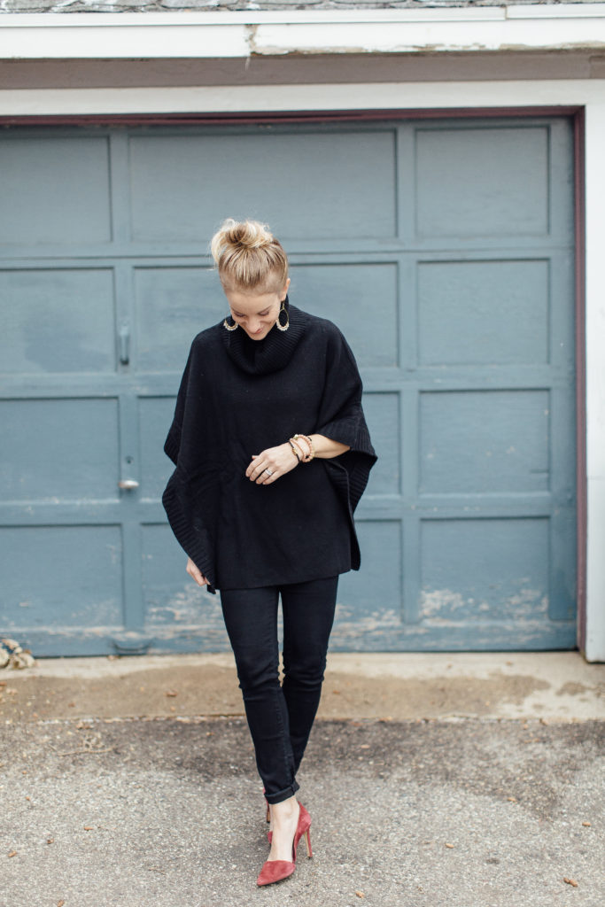 All black outfit, black skinny jeans, black poncho and maroon heels
