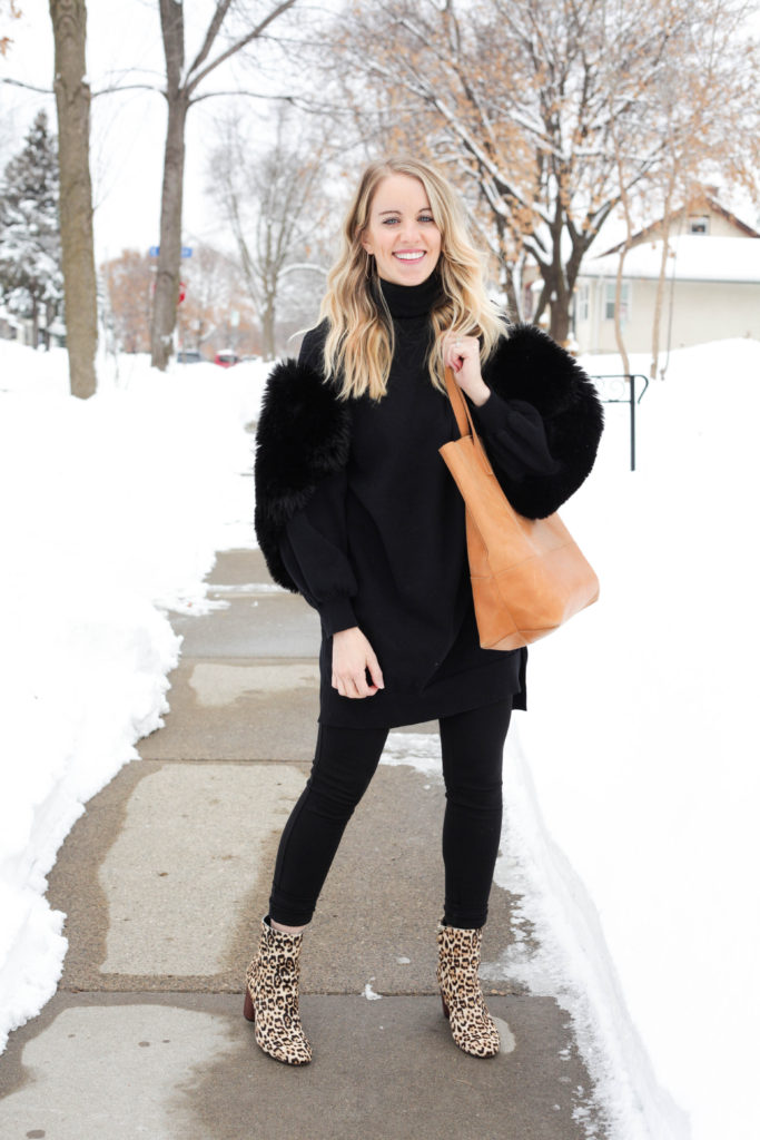 Unique winter outfit with furry sleeve sweater, ethically made able mamuye tote and leopard boots.