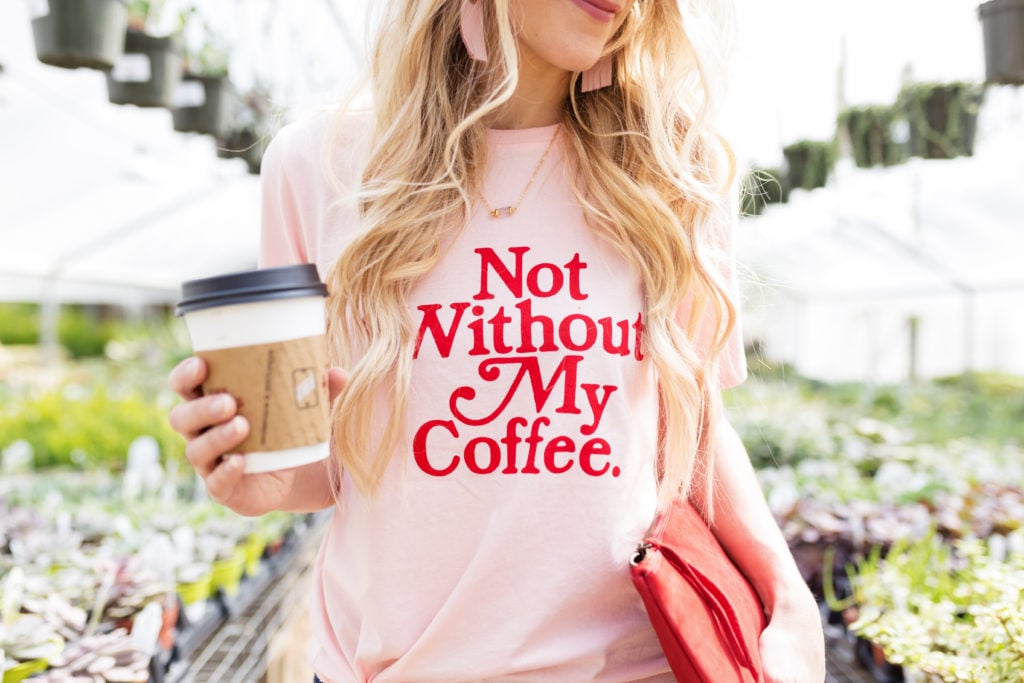 Woman with long blonde hair and Not Without My Coffee tee