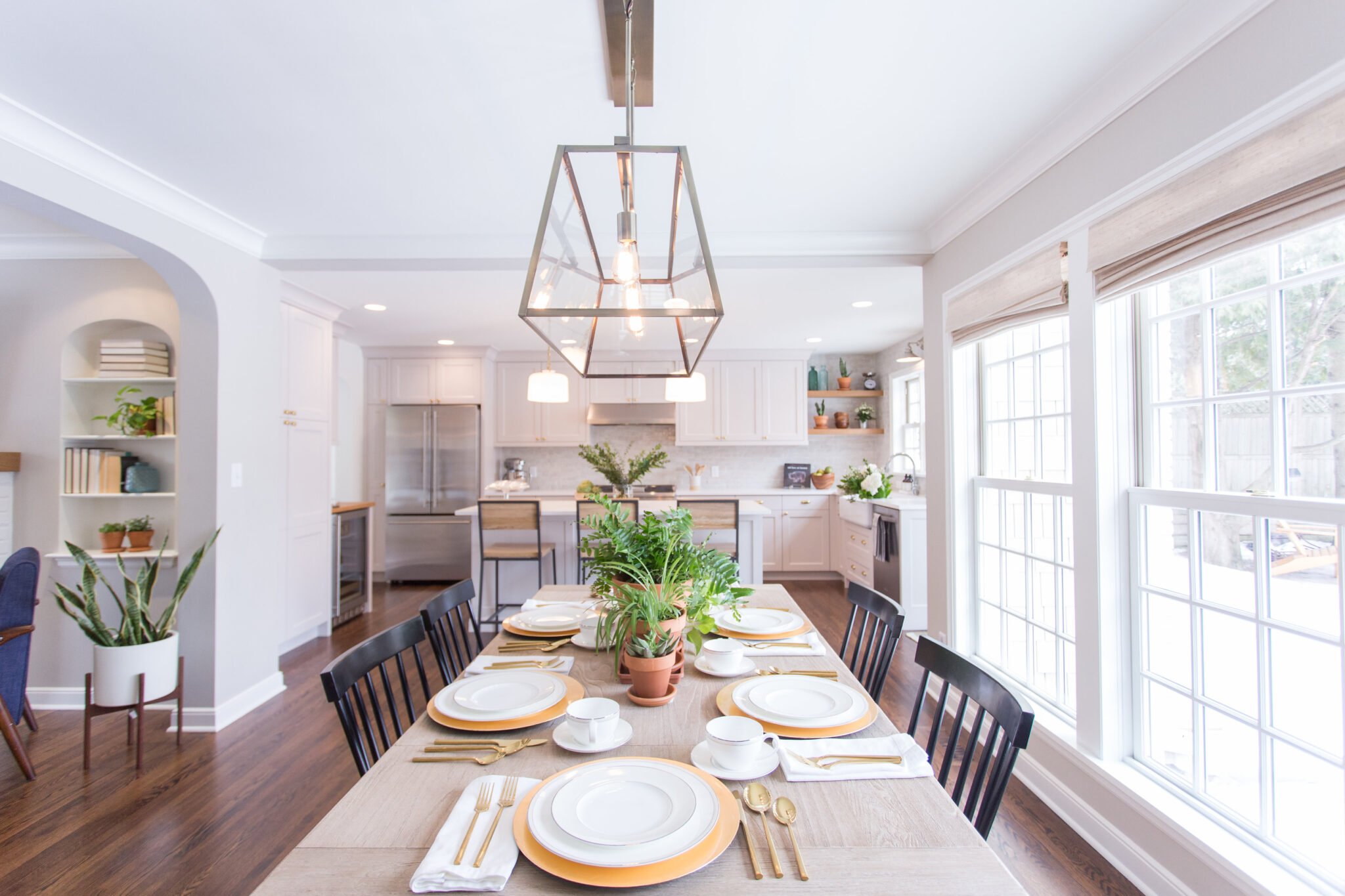Dining room table with houseplants as centerpiece