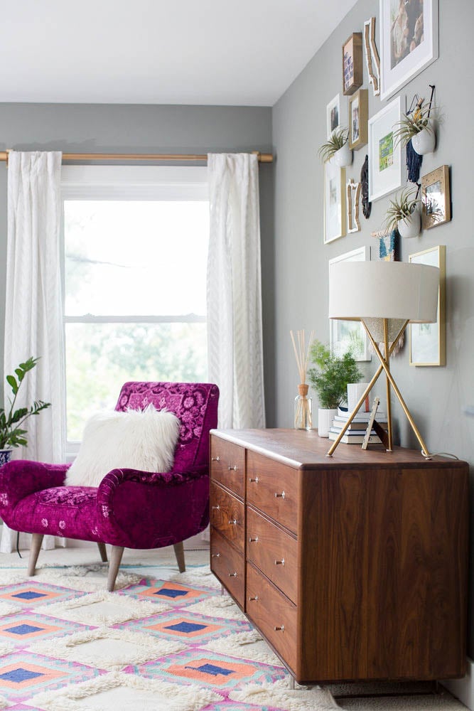 Bright Master Bedroom - Room and Board dresser, gallery wall and fuchsia arm chair from Anthropologie