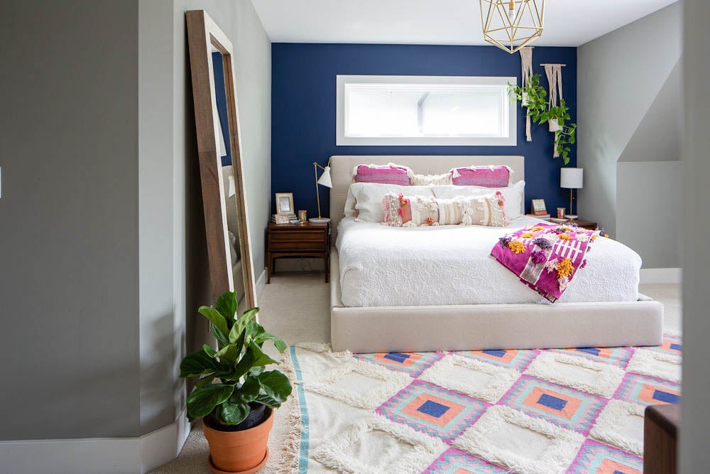 How to Decorate Your Bedroom - Navy accent wall, hanging plants and Anthropologie bedding