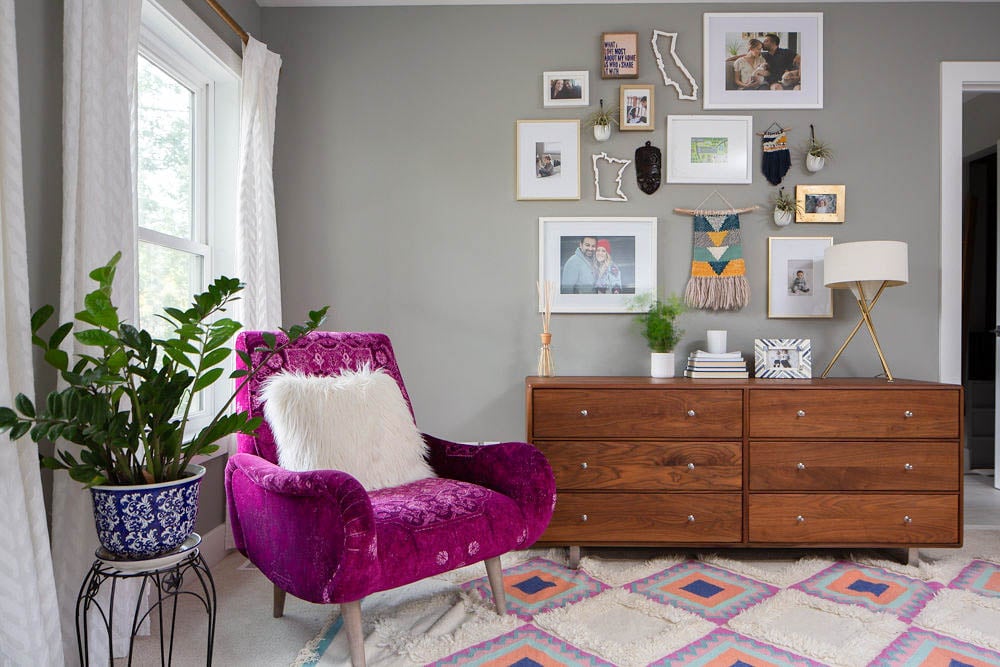 Bright Master Bedroom - Room and Board dresser, gallery wall and fuchsia arm chair from Anthropologie 