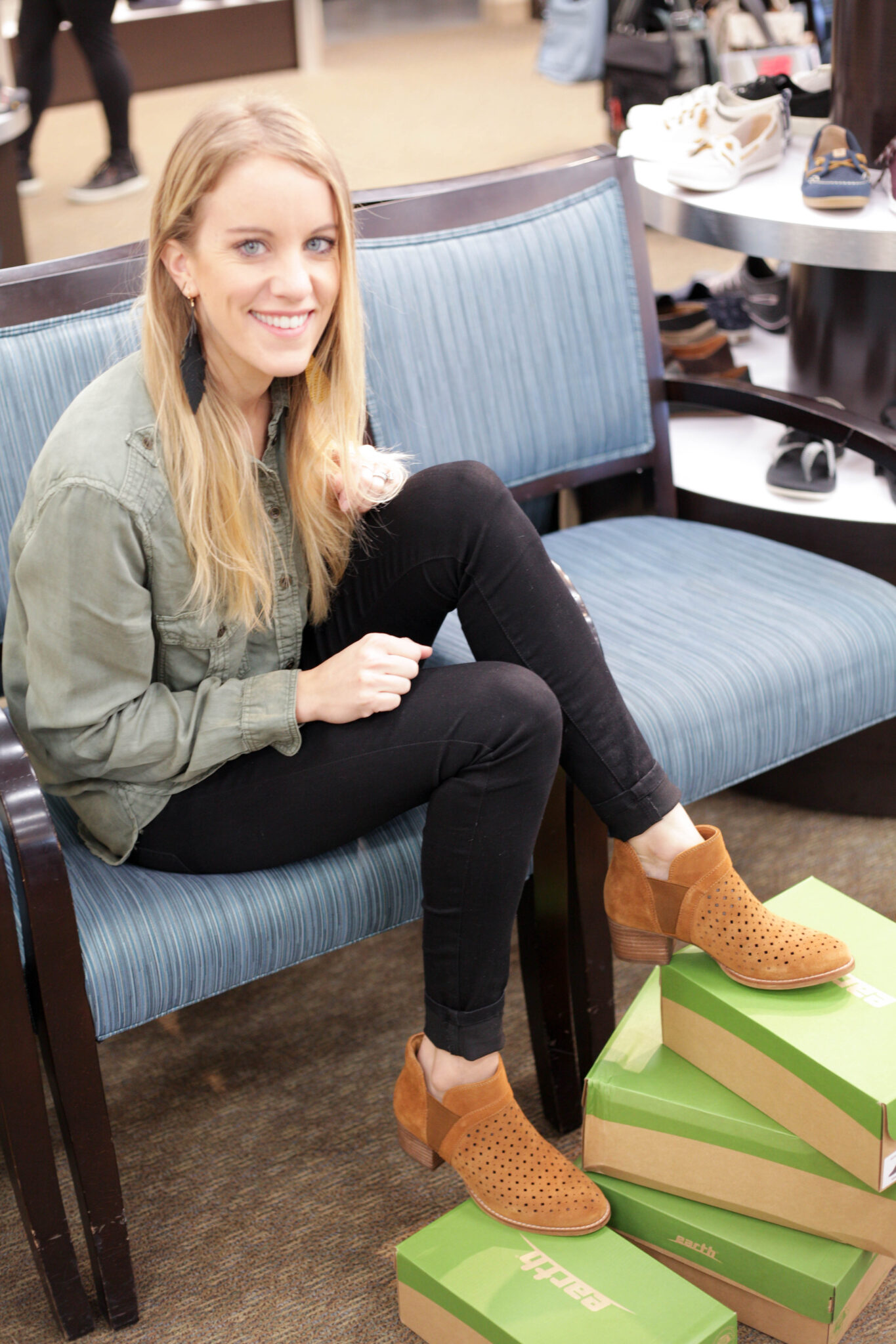 jen biswas paisley and sparrow trying on earth brand shoes at shuler shoes in st paul minneosta