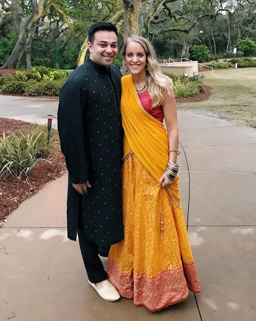 Couple, woman wearing yellow and red lehnga