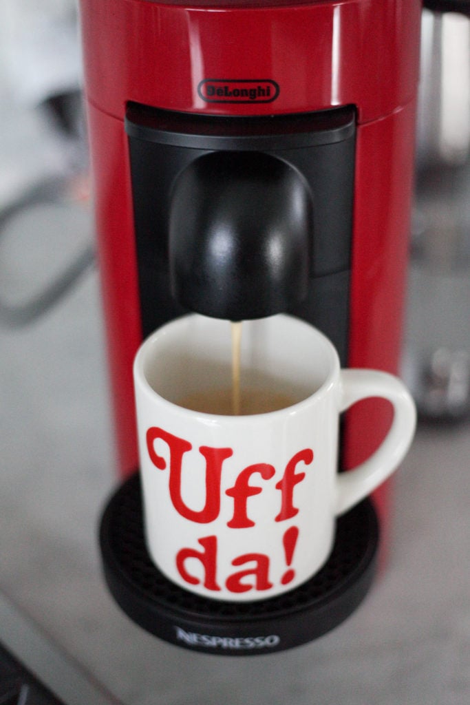 nespresso vertuo plus pouring coffee into a mug
