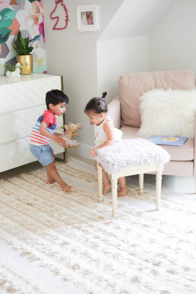 two kids playing in toddler room