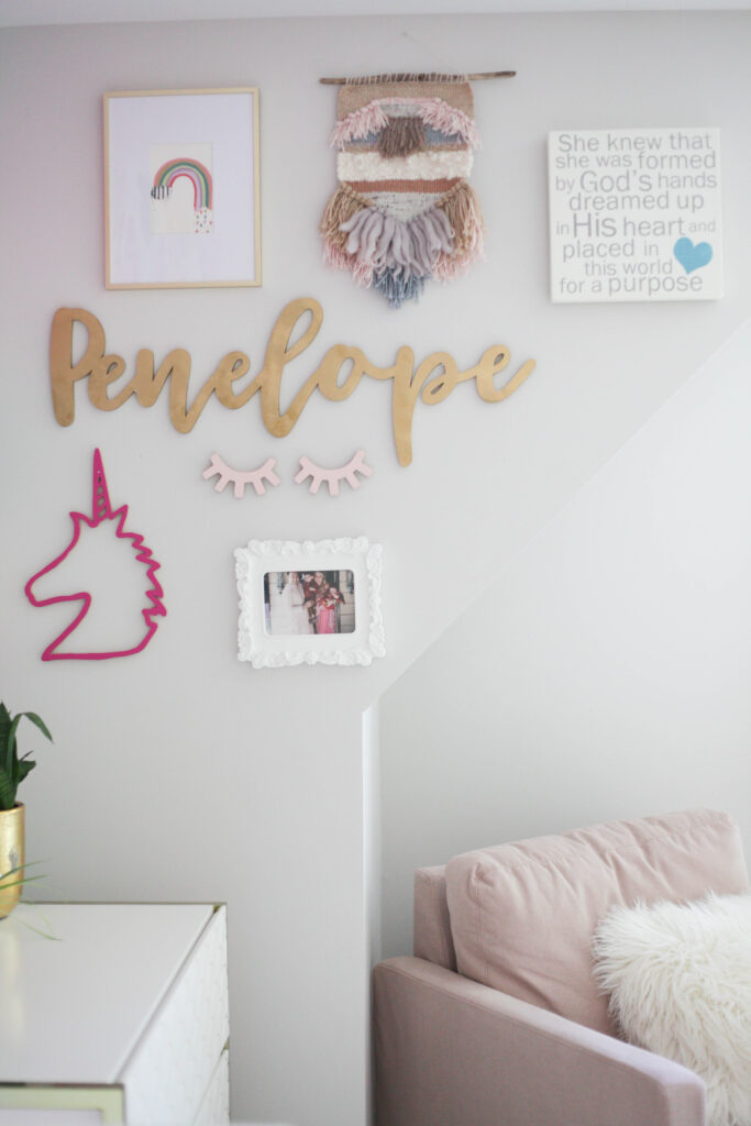Gallery wall in toddler room with fiber art, rainbow art, unicorn, name, photo and word art