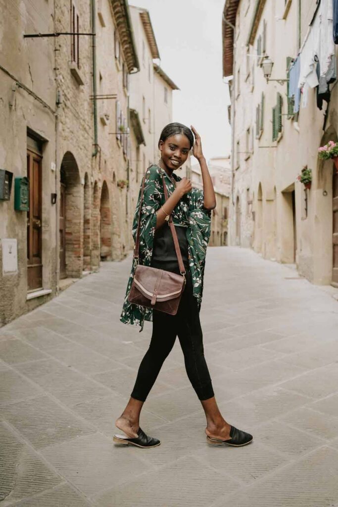 Woman wearing black leggings with green wrap