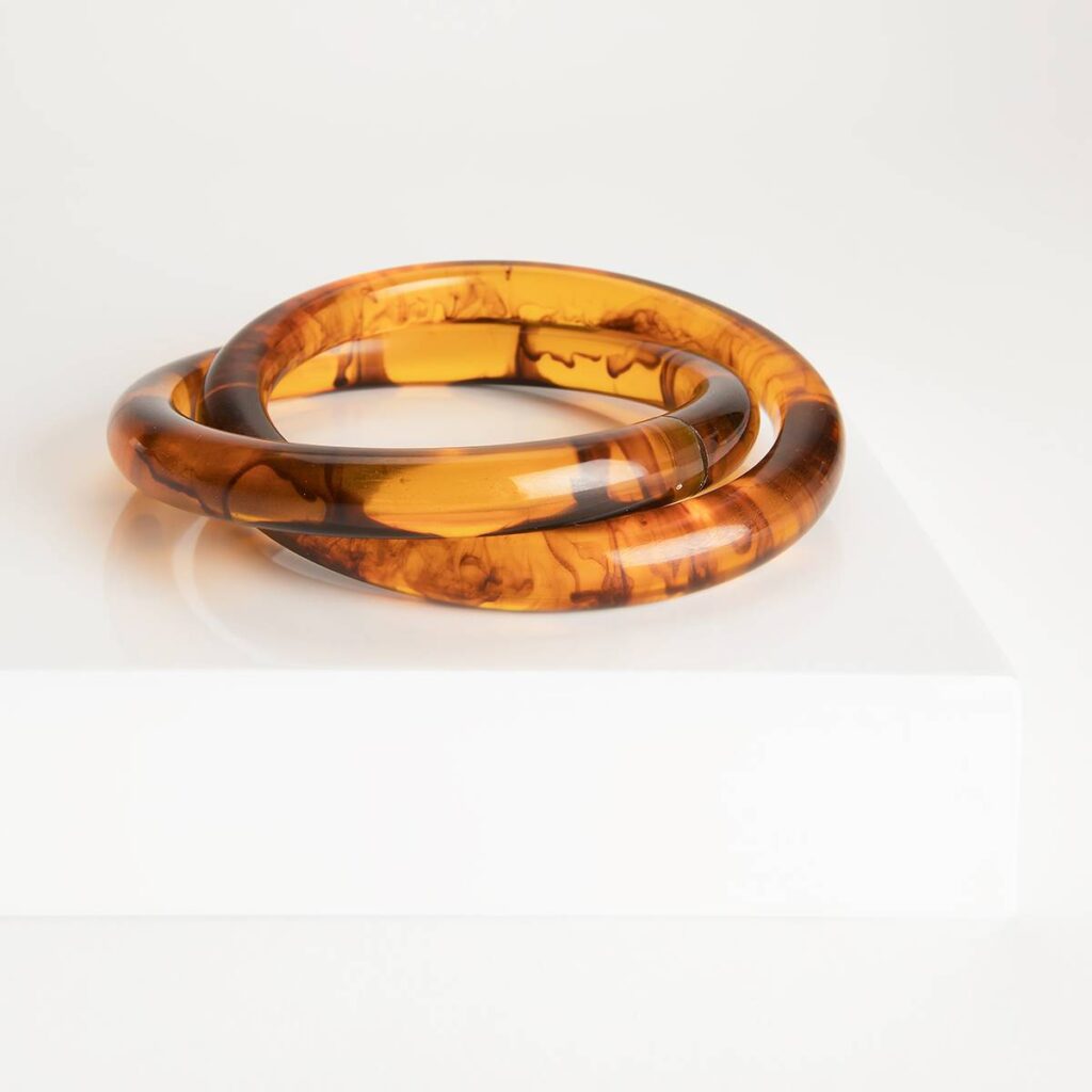 Two tortoise resin bangles