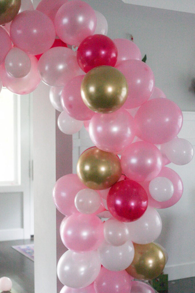 Pink, white and gold balloon garland for a Minnie Mouse birthday!