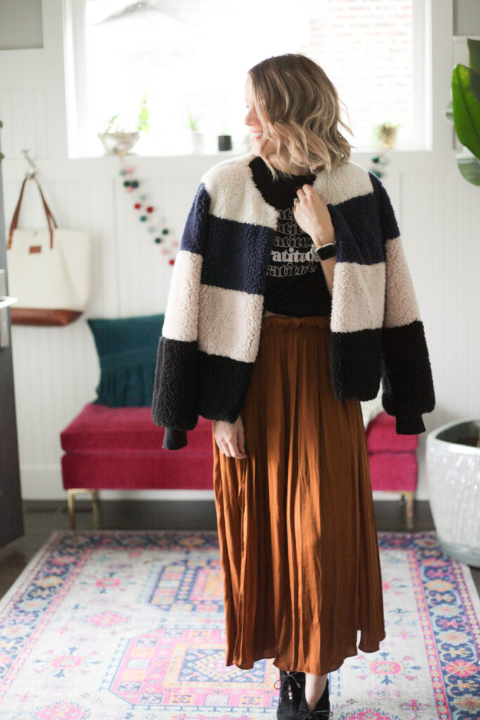 Midi skirt with graphic tee and striped jacket