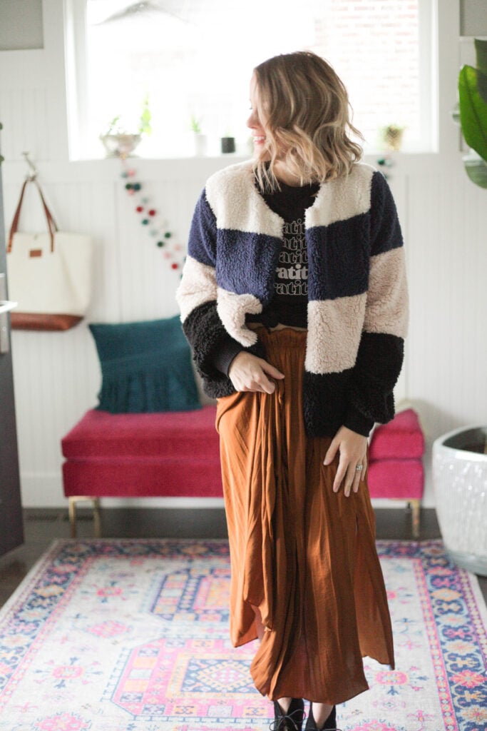 Midi skirt with graphic tee and striped sherpa jacket