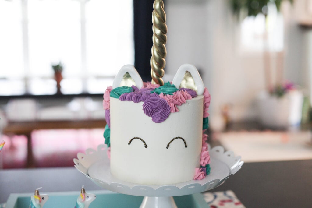 Pink, purple and teal unicorn birthday cake for a 1 year old birthday party