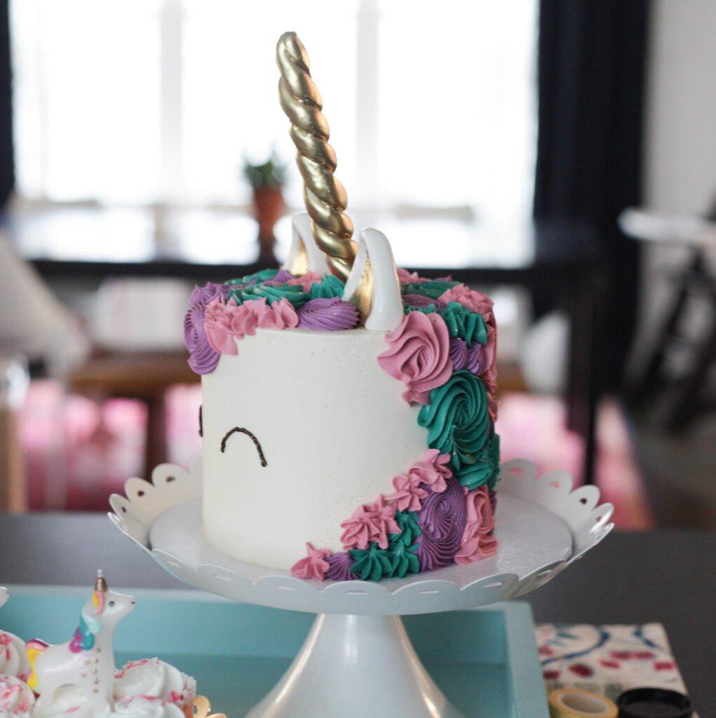 Pink, purple and teal unicorn birthday cake for a 1 year old birthday party