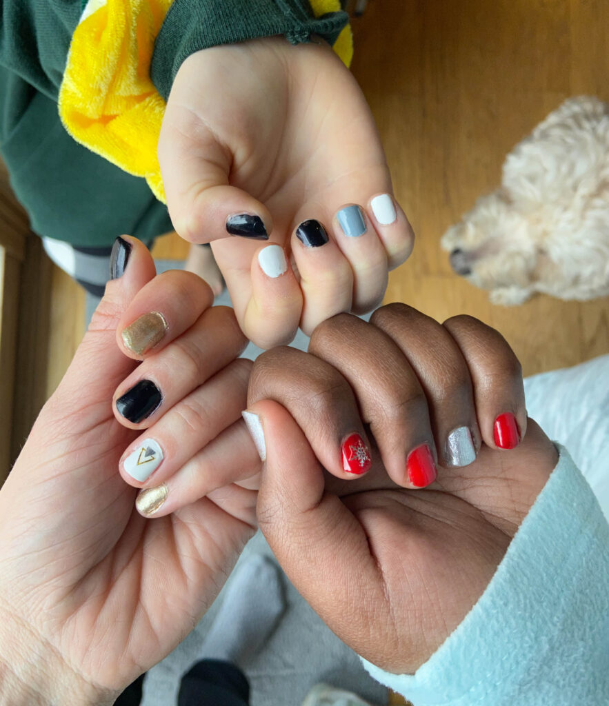 3 women with manicured nails