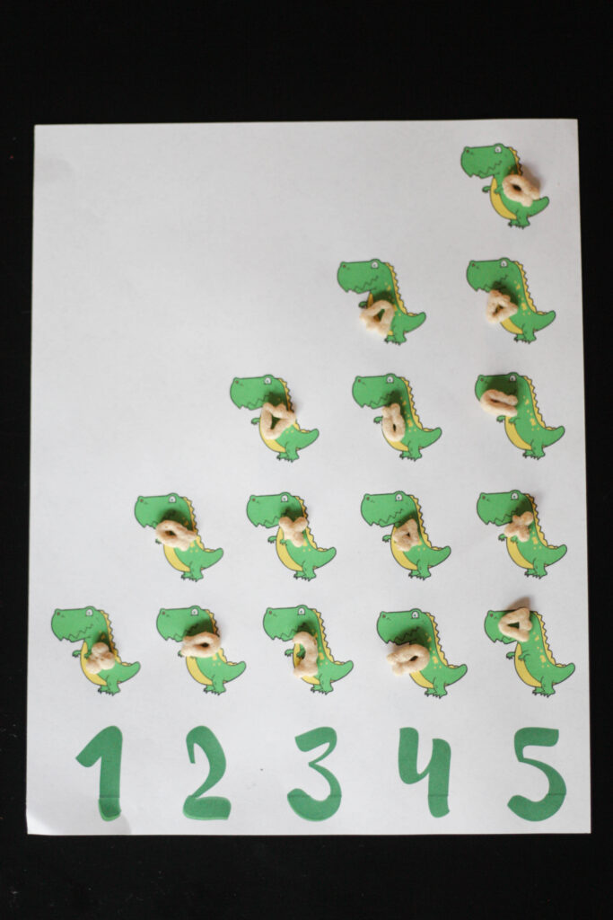 Dinosaur counting sheet with cereal