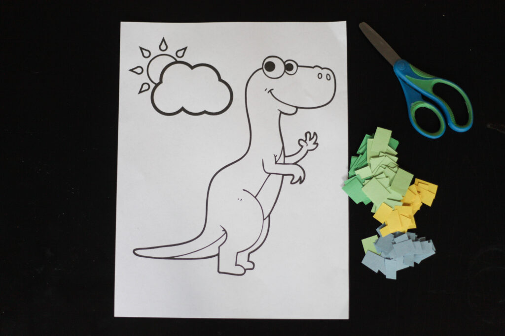Scissors, construction paper and dinosaur coloring sheet