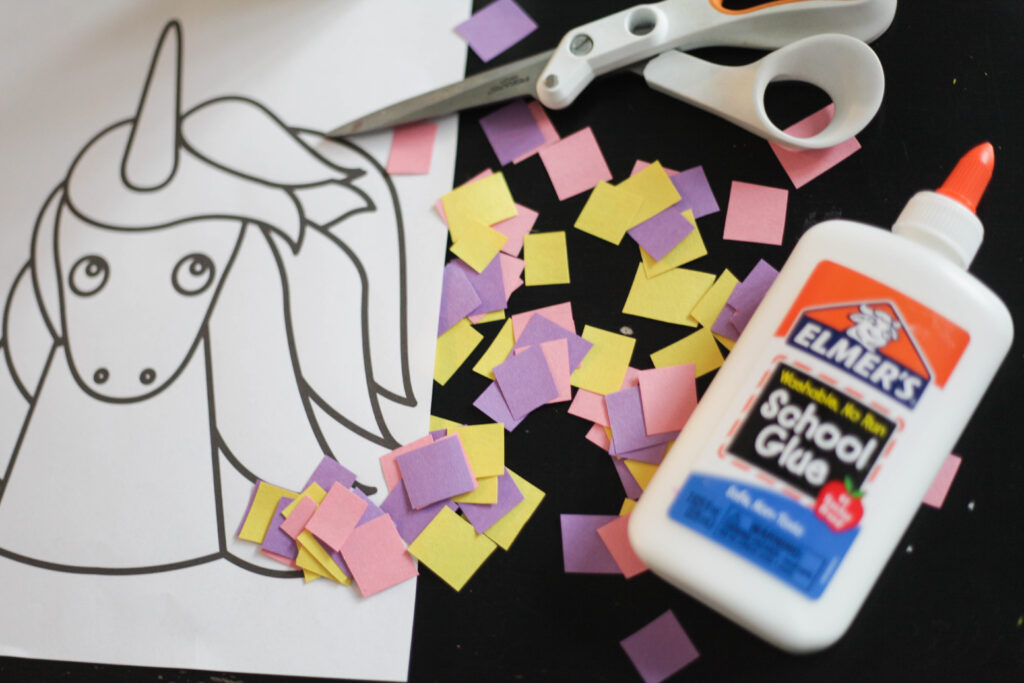 Glue, scissors, construction paper and unicorn coloring sheet