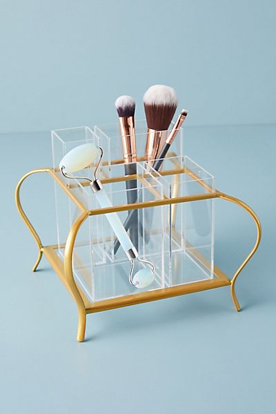Clear and gold organizer for makeup brushes