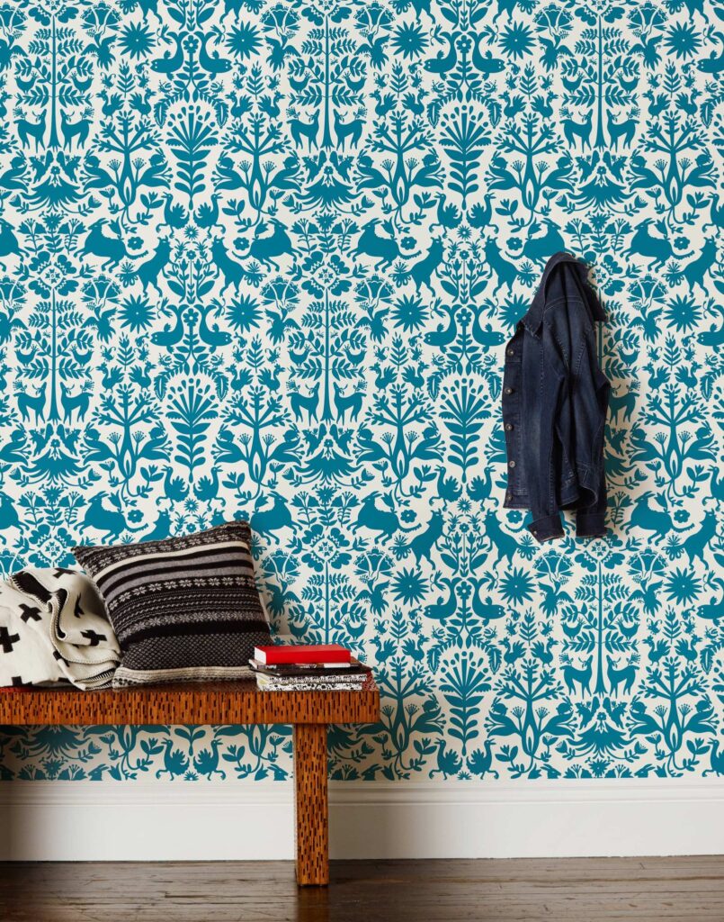 Entryway with teal forest pattern wallpaper