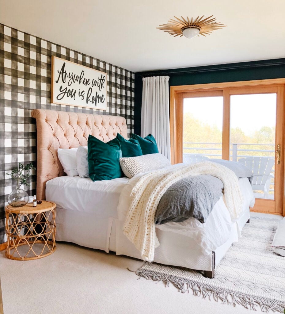 Bedroom with big gingham wallpaper on one wall