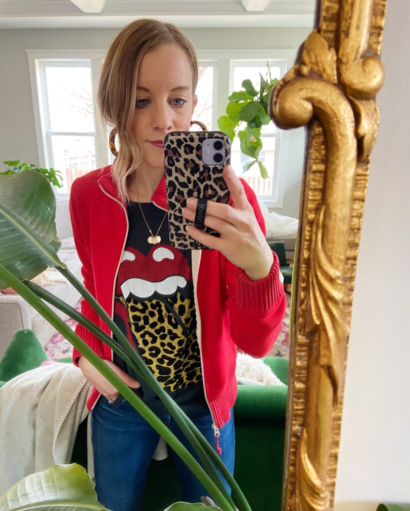 Woman in Rolling Stone leopard tongue tee and red sweater