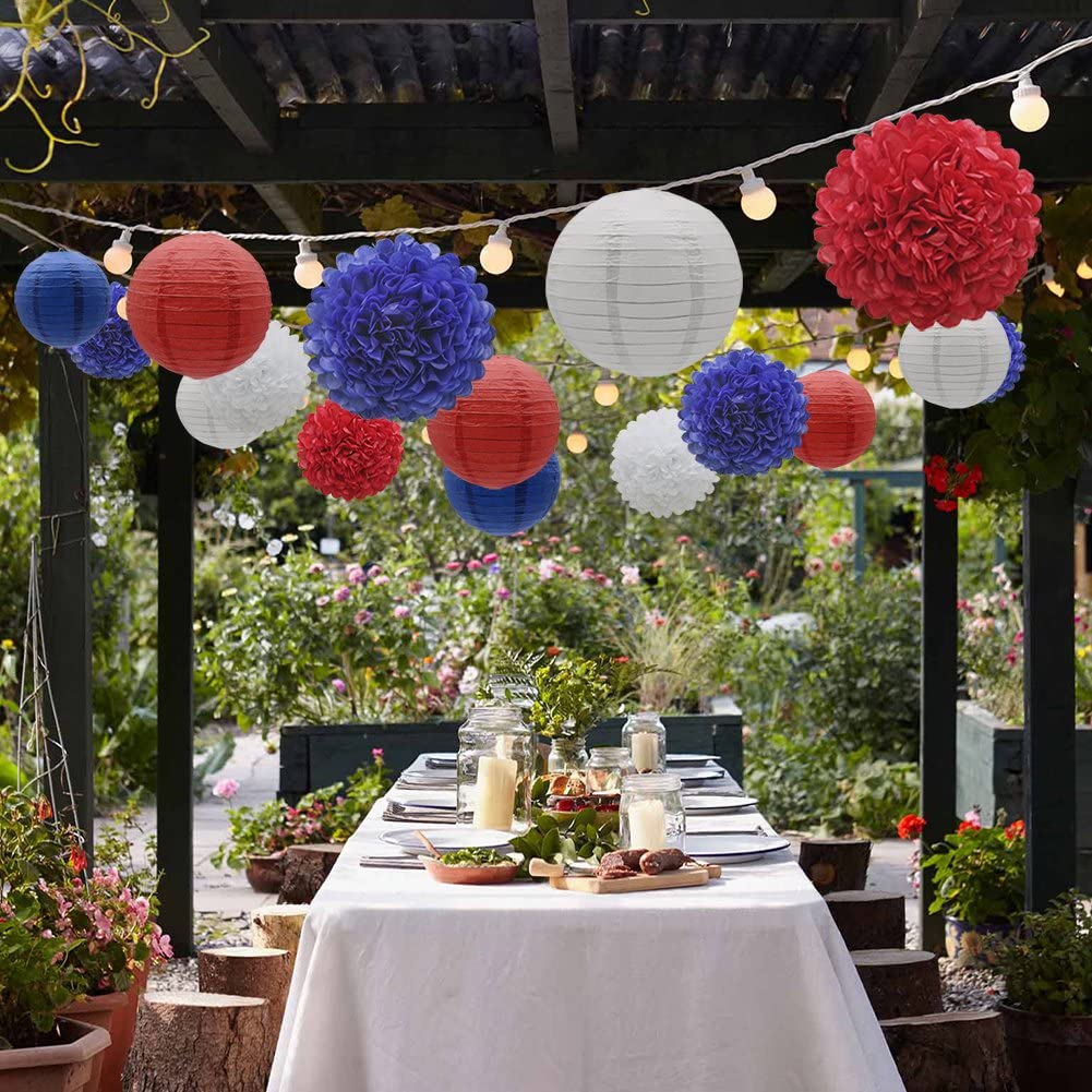 Red white and blue paper flowers and lanterns hanging above tablescape