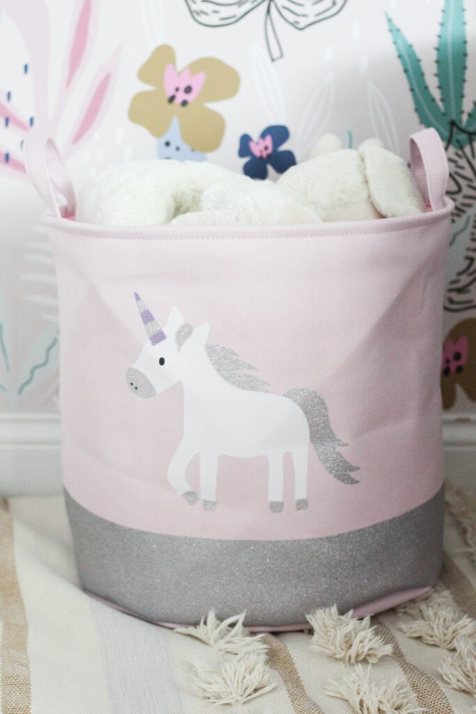 Pink storage bin with unicorn on it