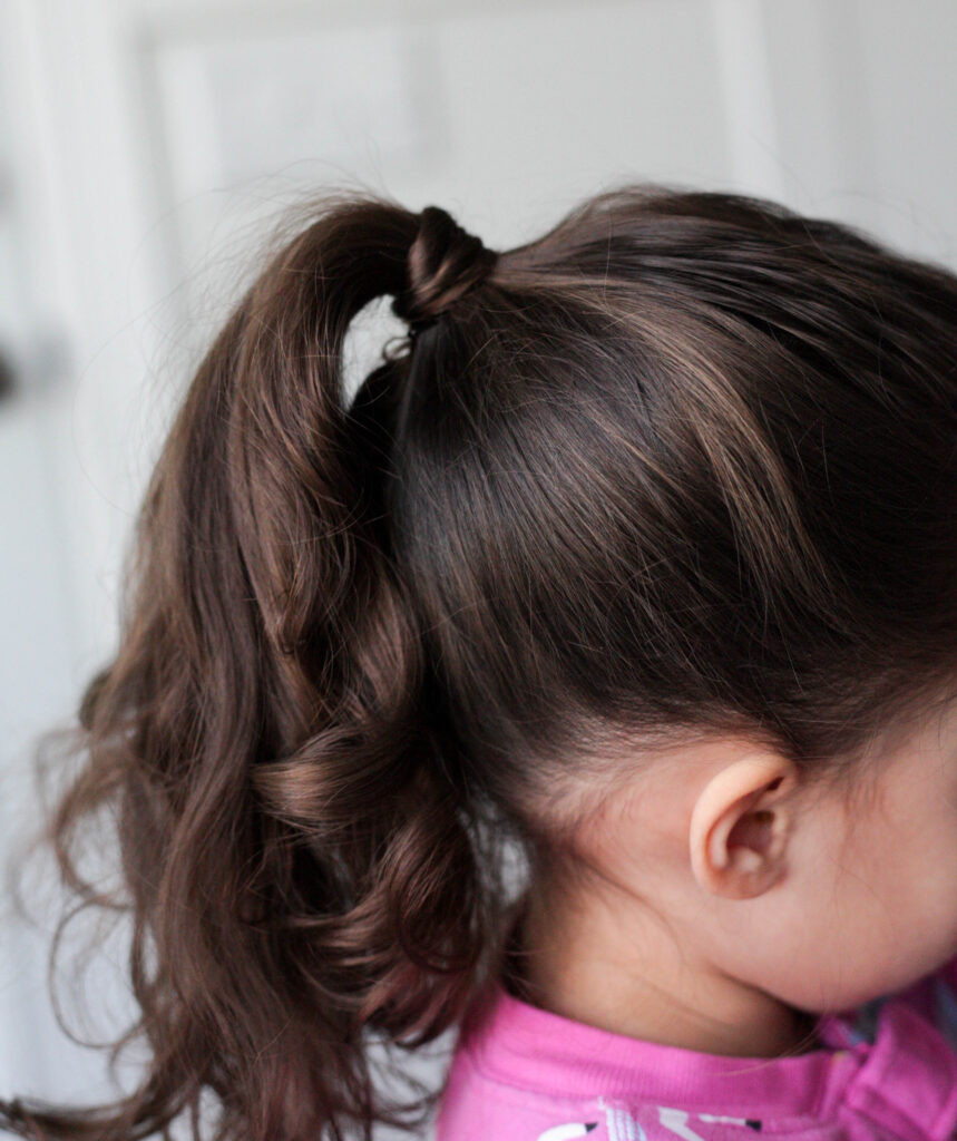 ponytail with hair tie covered