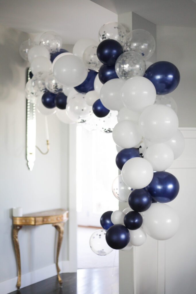 Navy, white, and silver confetti balloon garland
