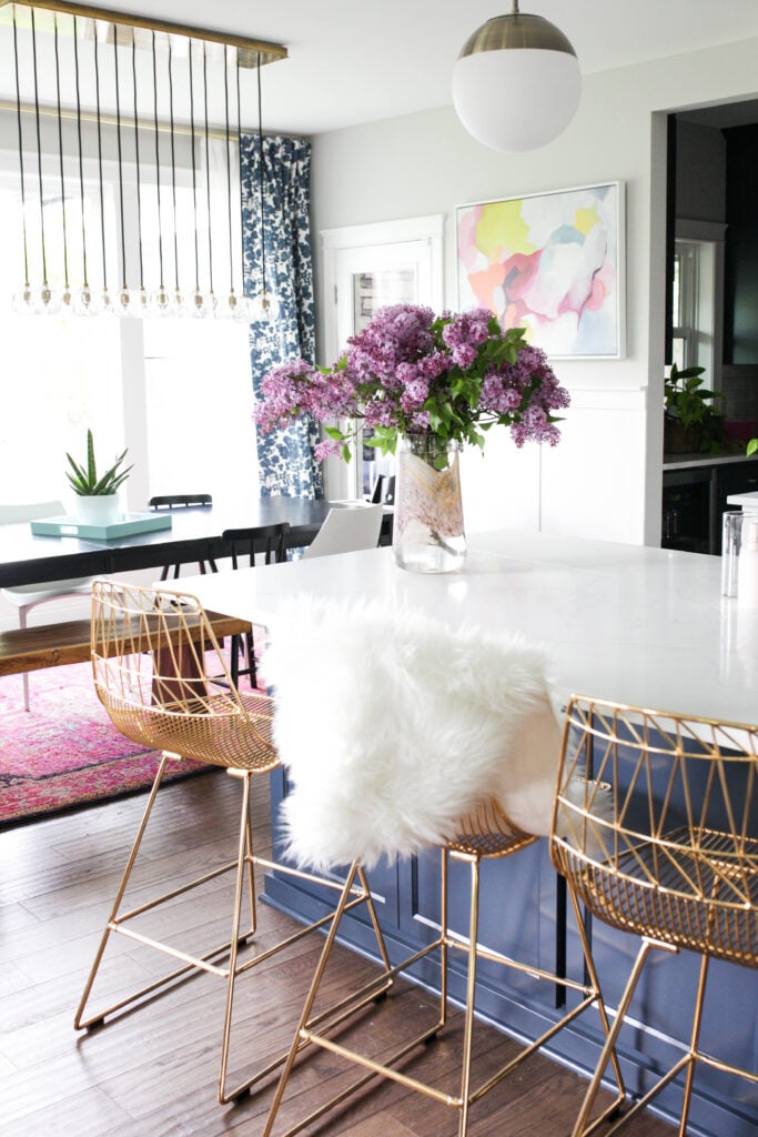 Full lilacs in vase in kitchen