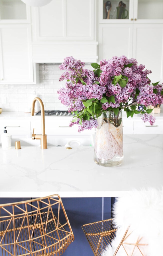Lilacs in vase on kitchen counter