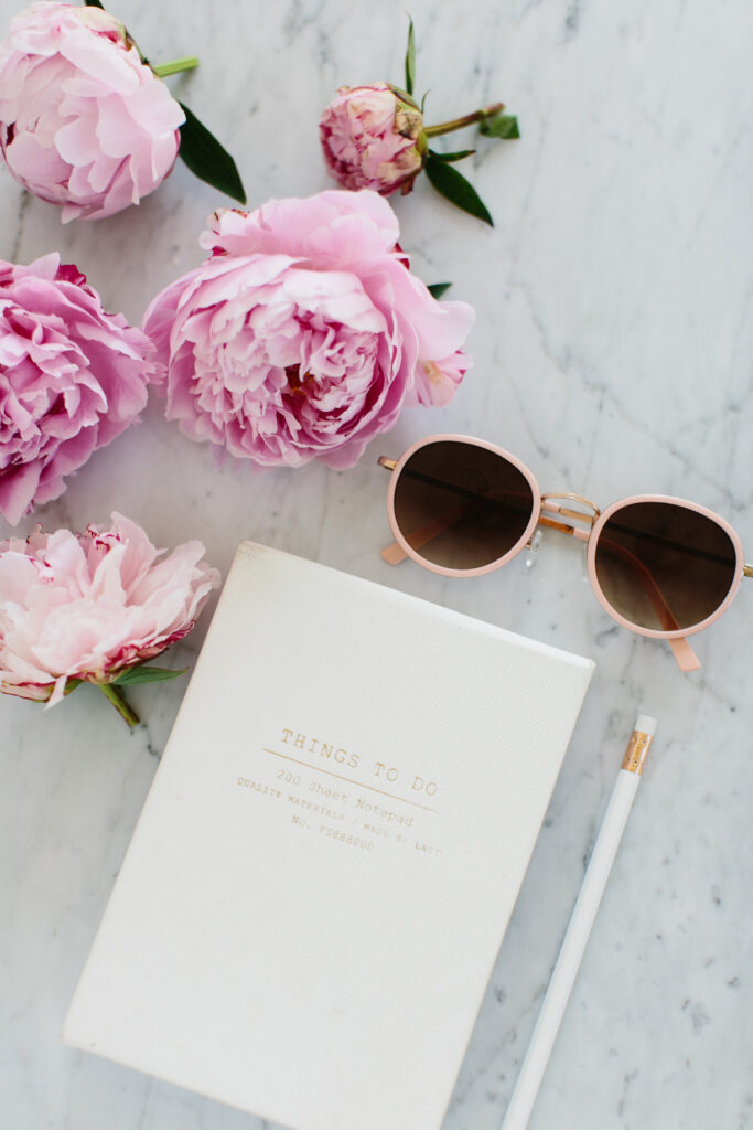 journal and flowers on counter