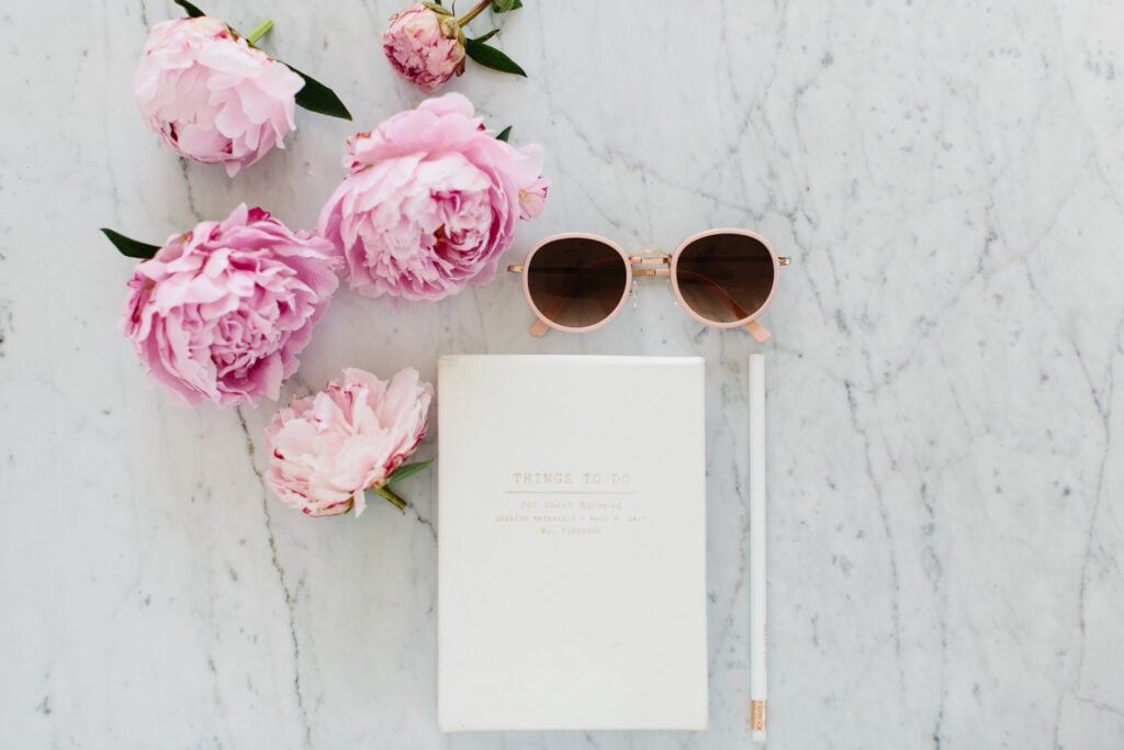 journal and flowers on counter