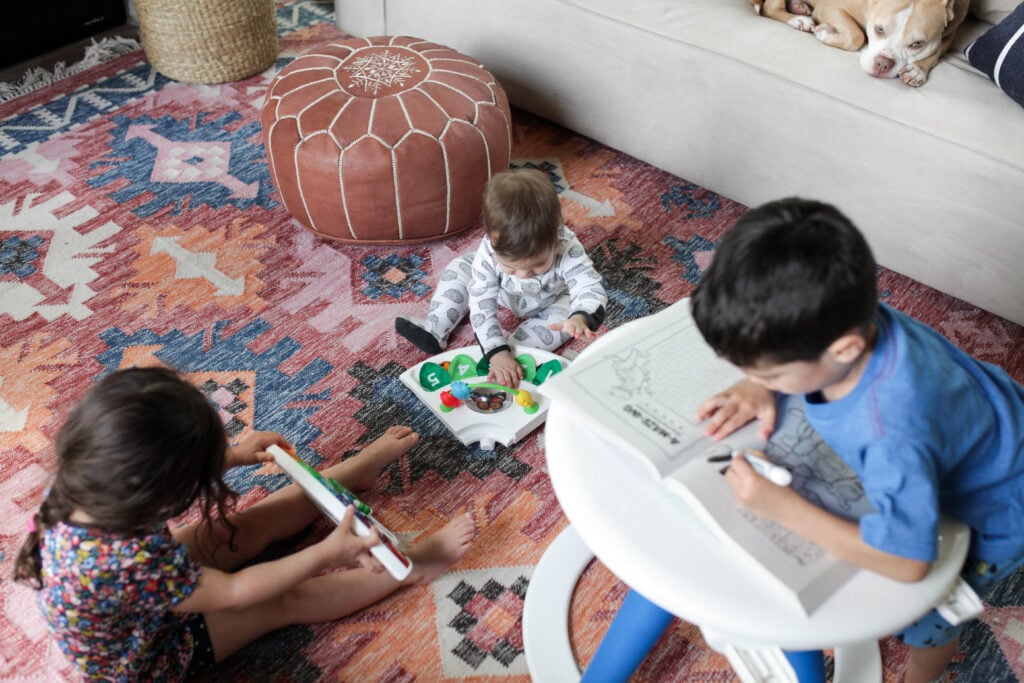 Kids playing with removable floor toys from Baby Einstein Around We Grow