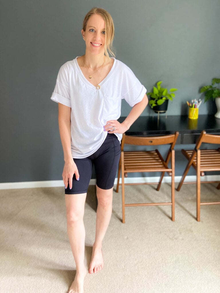 woman wearing bike shorts and white shirt