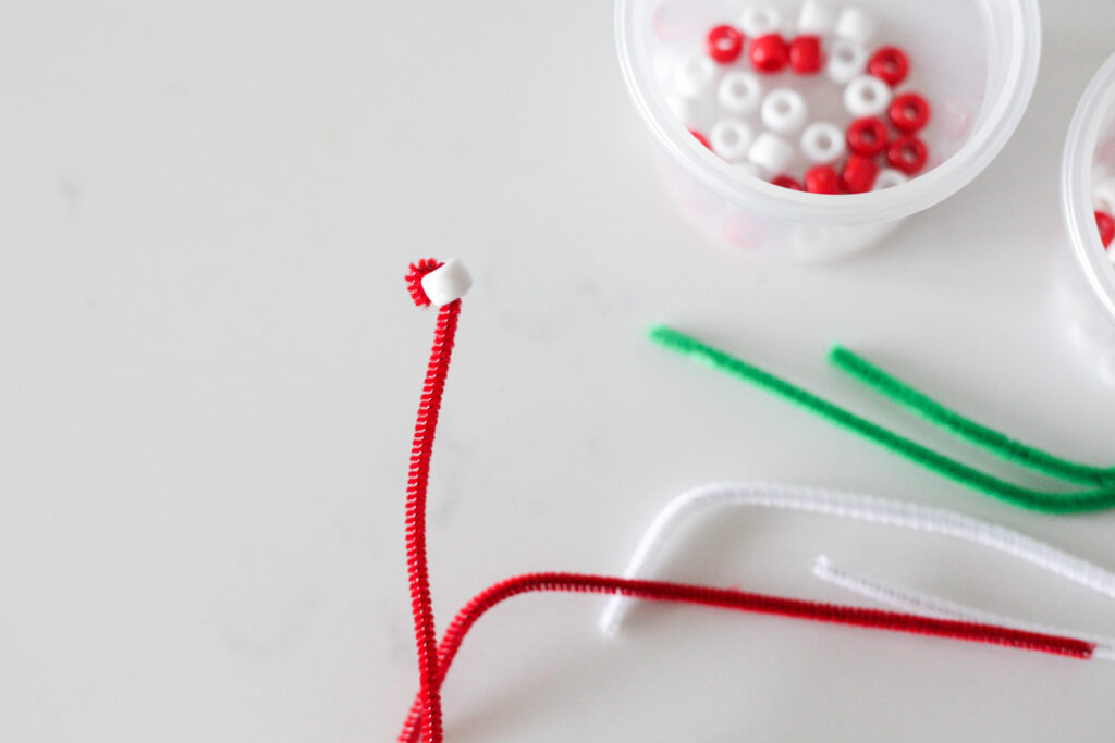 One bead on a red pipe cleaner