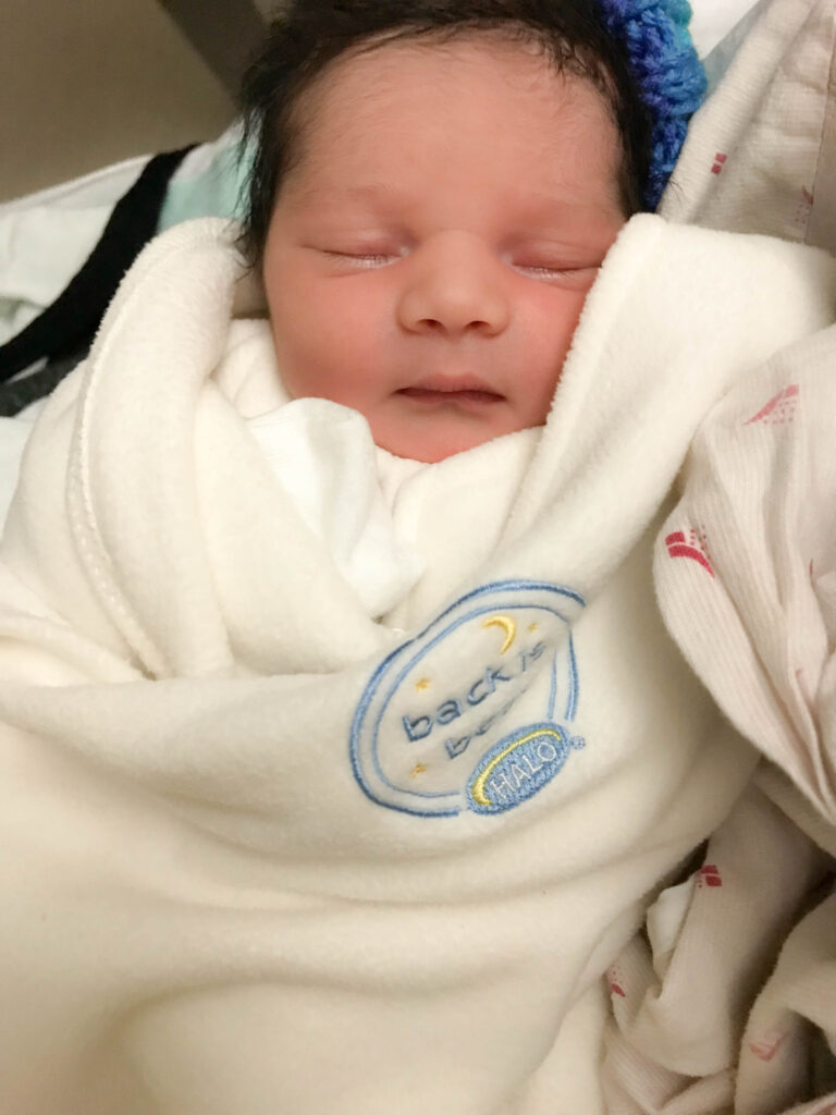 newborn baby in halo sleepsack