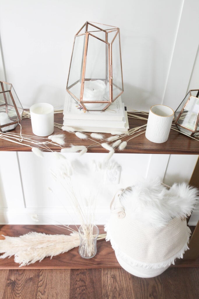 Lanterns and light decor on console table