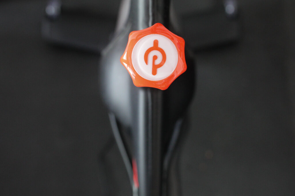 Close up of Peloton logo on bike
