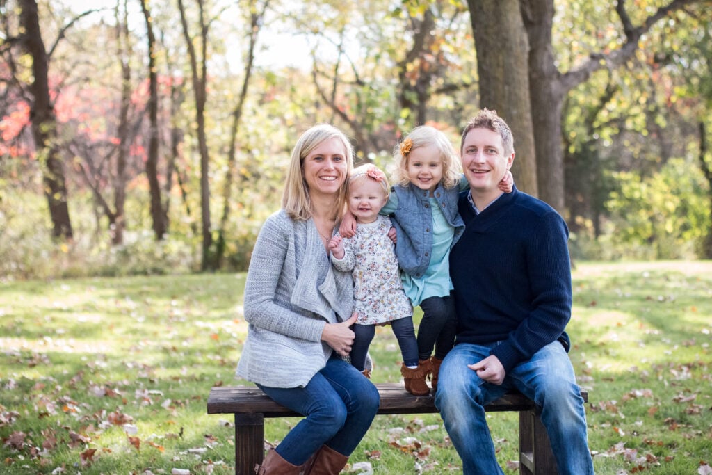 Family in coordinating clothes, one pattern, the rest solids