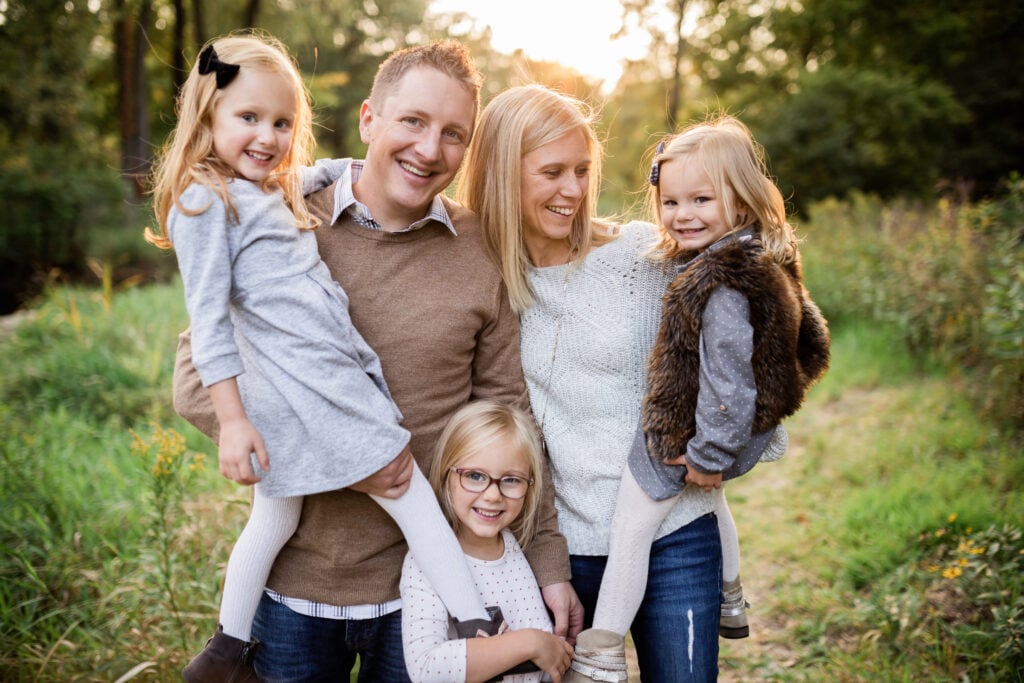 Family in neutral coordinating clothes