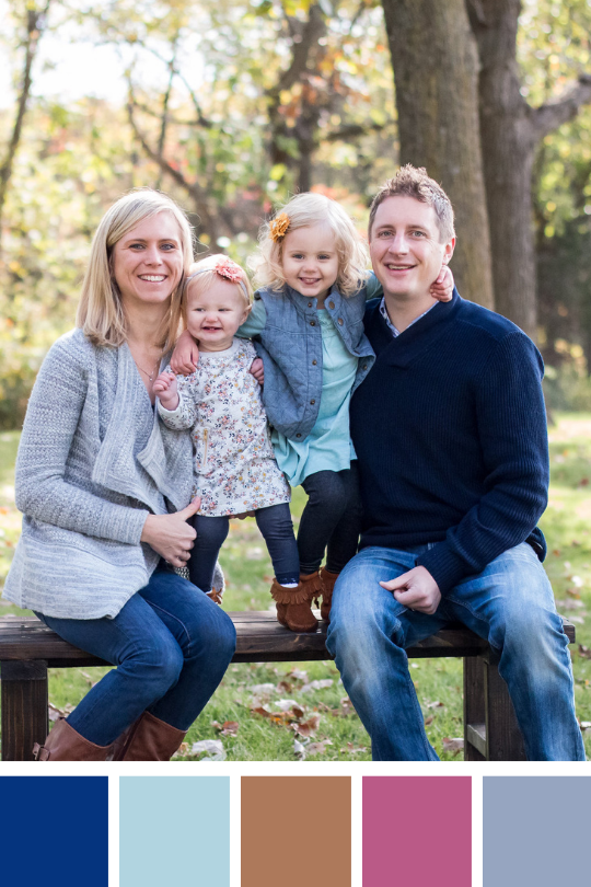 Family in coordinating outfits with a blues, grays, brown and pink palette