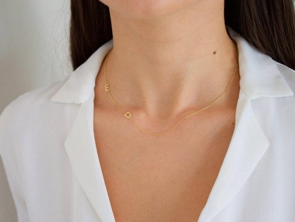 Gold necklace with two initials on the chain
